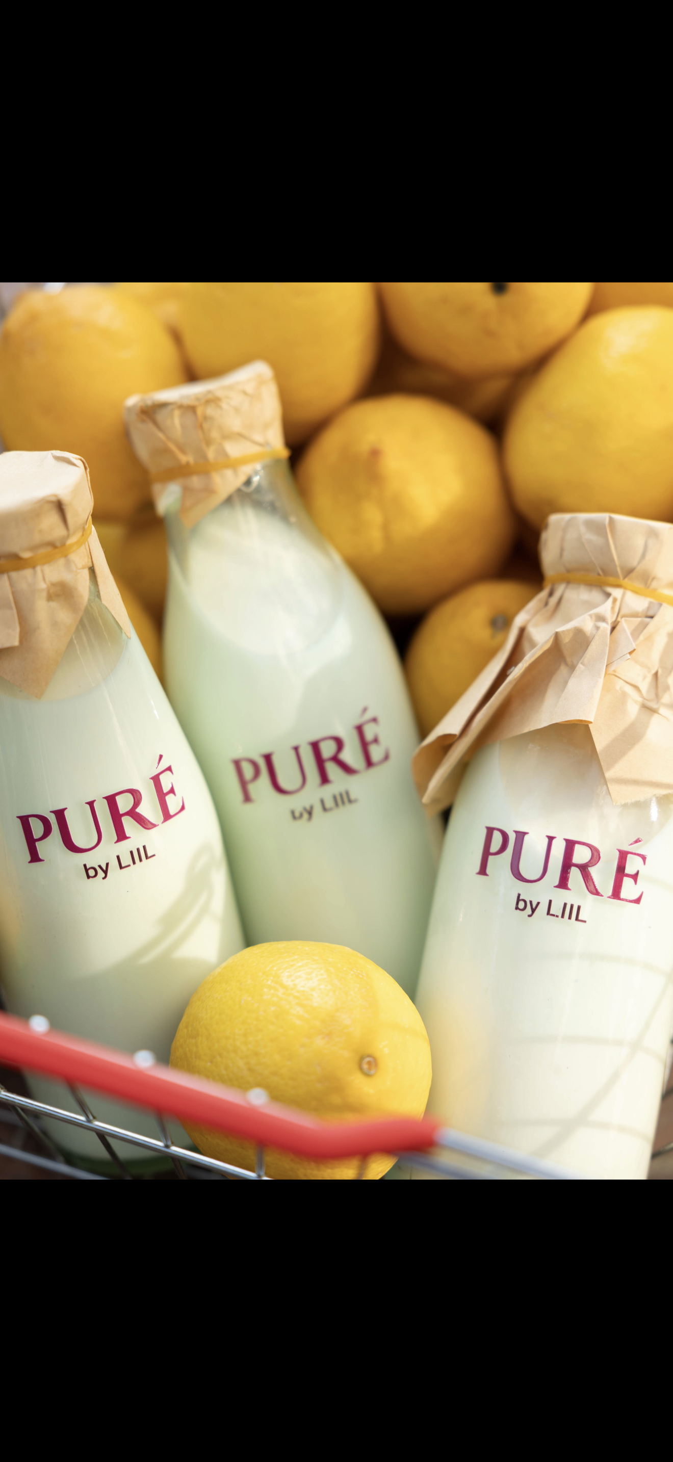 PURÉ bottles in basket close-up