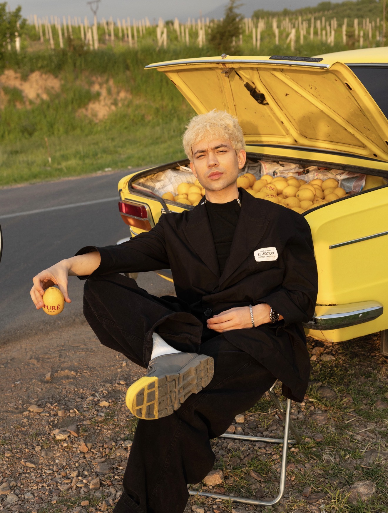 LiiL with PURÉ lemons in yellow vintage car